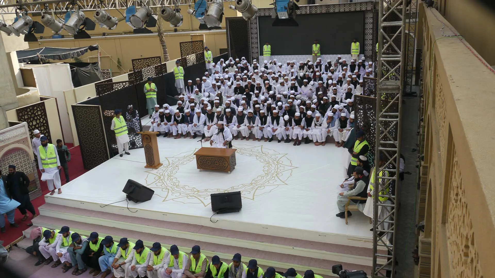 Event stage with ulema and guests